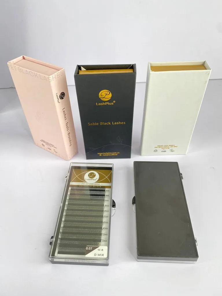 A custom rigid lash box with its loaded tray insert set beside it — a real production run